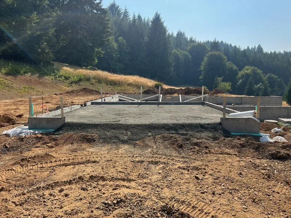 Prepared gravel pad within concrete foundation walls